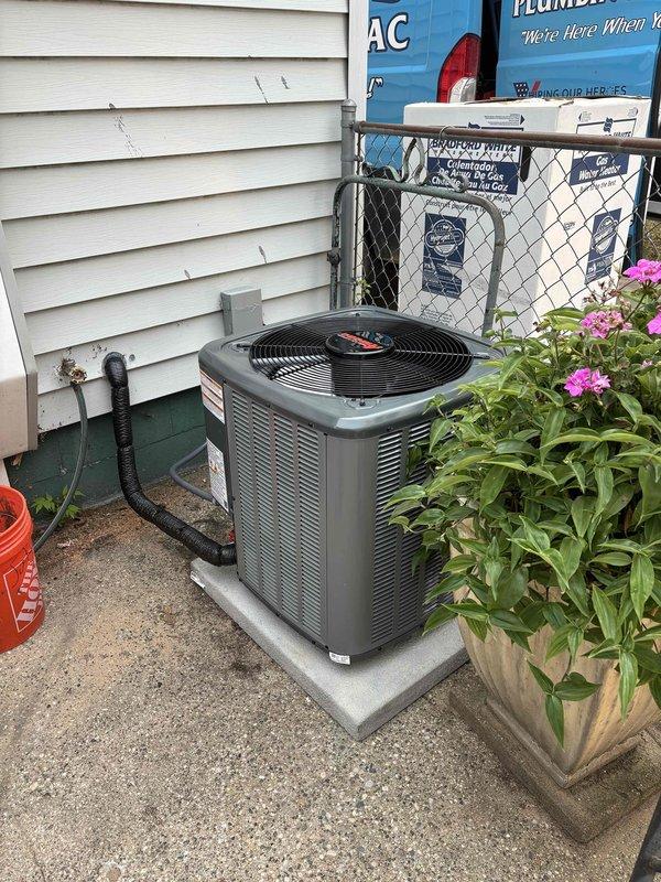 Completed full replacement of residential air conditioning system and water heater. Installed new AC condenser unit on existing concrete pad with proper electrical disconnect and refrigerant line connections to exterior wall. Replaced existing water heater with new Bradford White unit in basement location, including proper venting, gas line connections, and copper supply piping with appropriate fittings and safety controls.