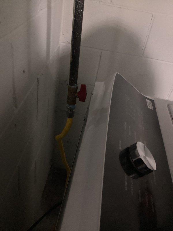 Responded to gas dryer hookup request in 1948-built home where newly delivered appliance could not be operated due to disconnected gas supply line. Upon arrival, found existing black iron gas pipe with shutoff valve hanging from ceiling joists, terminated with yellow flexible gas connector (CSST) that was not connected to dryer. Verified gas supply present in home and confirmed no other gas-related issues. Successfully connected the existing yellow flex line to new dryer gas inlet, tested all connections for leaks using approved leak detection solution, verified proper gas flow, and confirmed shutoff valve operation. Opened gas supply and performed final safety inspection of completed connection. Dryer now operational and ready for use.