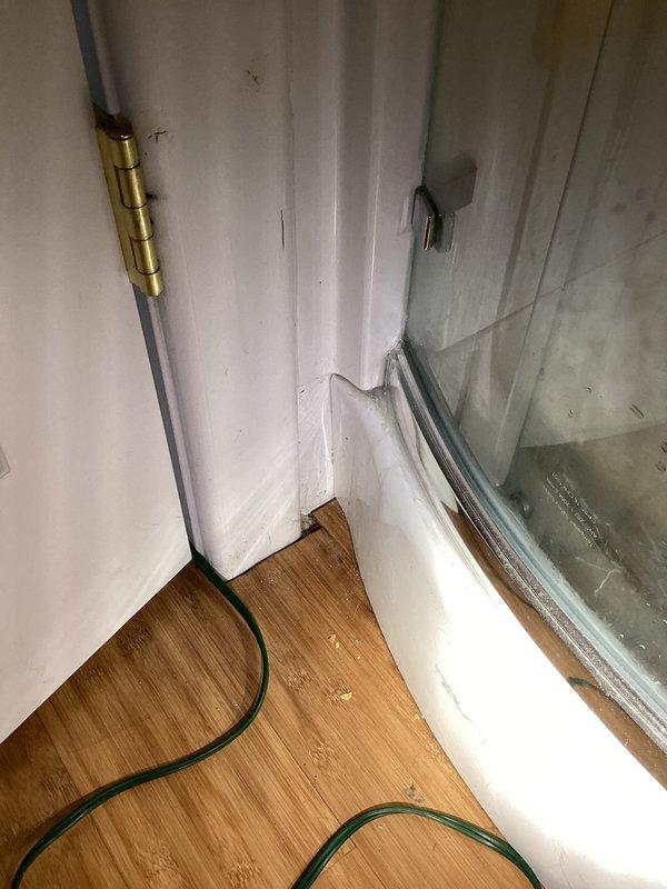 Responded to reported water leak from upstairs bathroom in living space above detached garage, with water infiltrating into garage area below. Inspected shower plumbing and drainage system to identify source of leak. Examined supply lines, drain connections, and shower valve assembly for signs of failure or improper sealing. Assessed sink plumbing in same bathroom area per customer request. Investigated recent occupancy changes that may have contributed to increased water usage and leak detection. Performed visual inspection of accessible plumbing components including supply lines, drain piping, and fixture connections. Documented conditions with photographs showing plumbing infrastructure and affected areas. Addressed immediate concerns to prevent further water damage to garage ceiling and contents below.