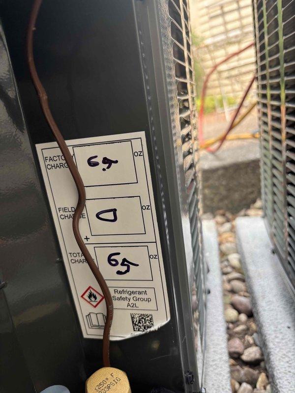 Completed full replacement of two AC systems including outdoor condensing units and indoor air handler components. Installed dual Lennox furnace units with proper ductwork connections, refrigerant line sets, condensate drainage, and PVC venting. Verified factory refrigerant charge of 45 oz with total system charge of 65 oz on outdoor unit utilizing A2L refrigerant safety classification. All electrical connections, control wiring, and communication cables properly terminated and tested for system operation.