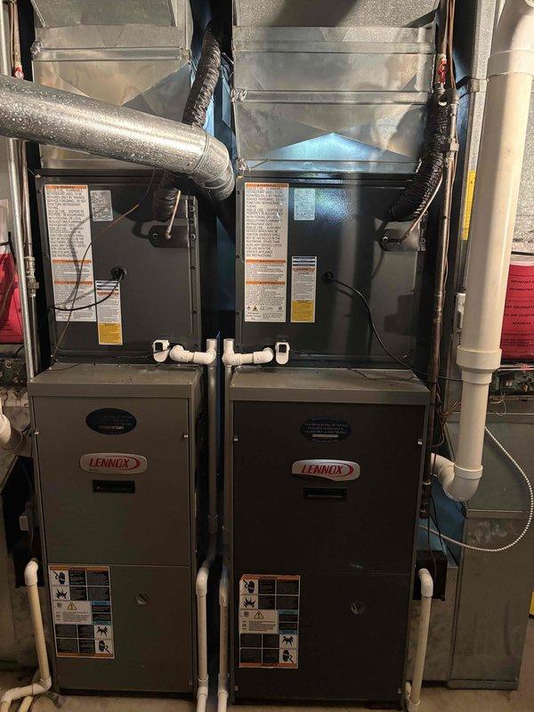 Completed full replacement of two AC systems including outdoor condensing units and indoor air handler components. Installed dual Lennox furnace units with proper ductwork connections, refrigerant line sets, condensate drainage, and PVC venting. Verified factory refrigerant charge of 45 oz with total system charge of 65 oz on outdoor unit utilizing A2L refrigerant safety classification. All electrical connections, control wiring, and communication cables properly terminated and tested for system operation.
