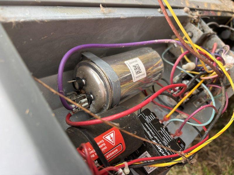 Responded to thermostat issue where unit was set to 73°F but home temperature remained at 80°F with air blowing but no cooling. Inspected evaporator coil and found dust accumulation within fin spaces affecting heat transfer efficiency. Examined electrical components including capacitor and relay connections in outdoor unit, verified all wire connections were secure and capacitor was functioning within specifications.