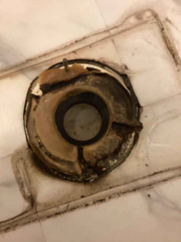 Responded to report of leaking toilet in residential bathroom. Upon arrival, assessed 4-6 year old toilet fixture showing signs of water seepage at base. Shut off water supply at angle stop valve and disconnected supply line. Removed toilet mounting bolts and carefully lifted fixture to expose flange and existing wax ring. Confirmed deteriorated wax ring as source of leak, with visible water damage and discoloration on subflooring around flange. Scraped away old wax ring material and cleaned toilet horn and closet flange thoroughly to ensure proper seal. Inspected flange for damage or deterioration; found flange in acceptable condition with secure anchoring to subflooring. Installed new wax ring with plastic horn onto closet flange, ensuring proper alignment. Repositioned toilet over flange, carefully aligning mounting bolt holes. Pressed toilet firmly into place to compress wax ring and create watertight seal. Reinstalled and torqued closet bolts evenly to manufacturer specifications,