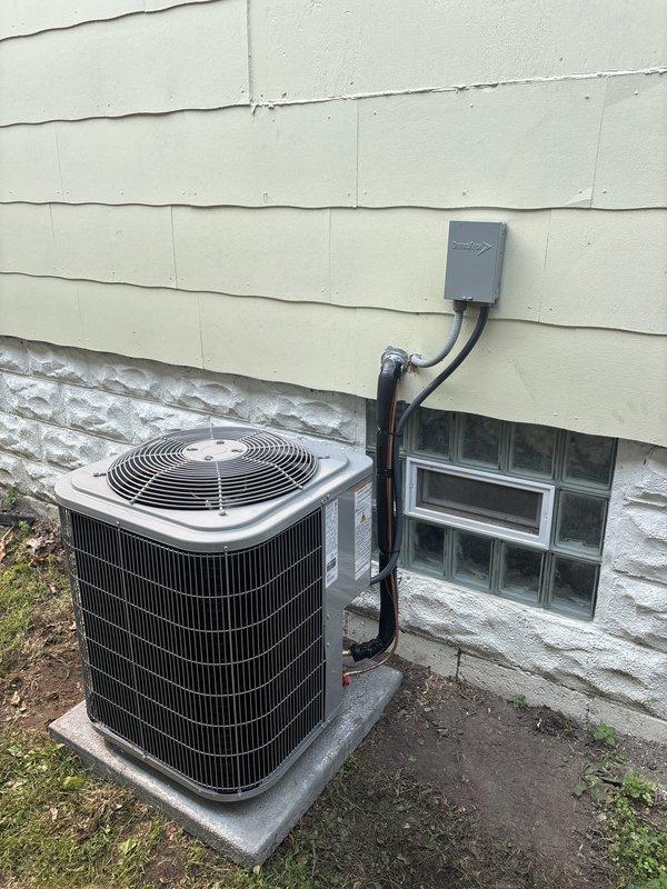 Completed full HVAC system replacement including installation of new Carrier furnace unit in basement utility area with proper ventilation ductwork, refrigerant line routing, and integrated humidifier system. Installed new outdoor air conditioning condenser unit on concrete pad with electrical disconnect box and conduit properly secured to exterior wall. All components tested and operational, documentation completed and posted on-site.