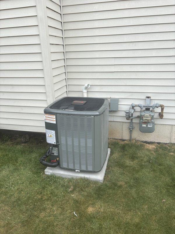 Completed full HVAC system replacement including installation of new air conditioning condenser unit on exterior concrete pad and new furnace/air handler in basement. Established proper refrigerant line connections between outdoor condenser and indoor coil system, installed condensate drain line with PVC piping, and verified electrical connections to both units. Tested system operation for proper cooling cycle, airflow, and temperature differential across the coil to ensure optimal performance and efficiency of the complete system.