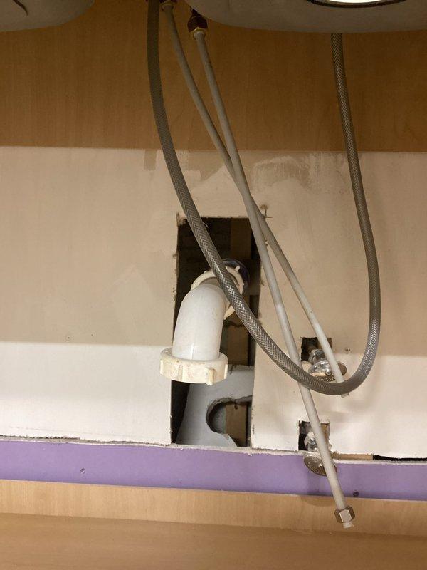 Responded to a basement kitchen plumbing service call to connect a faucet to existing water supply lines. Upon arrival, found an installed stainless steel double-basin sink with chrome faucet and sprayer attachment, but supply lines were not connected beneath the cabinet. Successfully connected the hot and cold water supply lines to the faucet assembly, tested for leaks, and verified proper water flow and drainage. Additionally inspected the gas oven as requested due to reported gas odor during operation, assessed the appliance for potential gas leaks or ventilation issues to ensure safe operation.