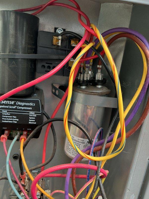 # No Cool Service Call

Responded to a no cooling complaint on a residential HVAC system. Upon arrival, performed diagnostic inspection of the outdoor condensing unit. Located a failed run capacitor preventing compressor operation. Removed the defective capacitor and installed a new replacement unit with proper specifications. Verified all electrical connections were secure and tested system operation. Unit restored to full cooling capacity with compressor and condenser fan motor running within normal parameters. Cleared vegetation growth around base of unit and advised on maintaining clearance for proper airflow and future serviceability.