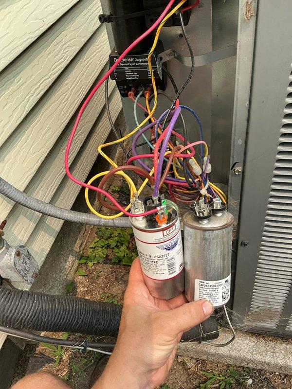 # No Cool Service Call

Responded to a no cooling complaint on a residential HVAC system. Upon arrival, performed diagnostic inspection of the outdoor condensing unit. Located a failed run capacitor preventing compressor operation. Removed the defective capacitor and installed a new replacement unit with proper specifications. Verified all electrical connections were secure and tested system operation. Unit restored to full cooling capacity with compressor and condenser fan motor running within normal parameters. Cleared vegetation growth around base of unit and advised on maintaining clearance for proper airflow and future serviceability.