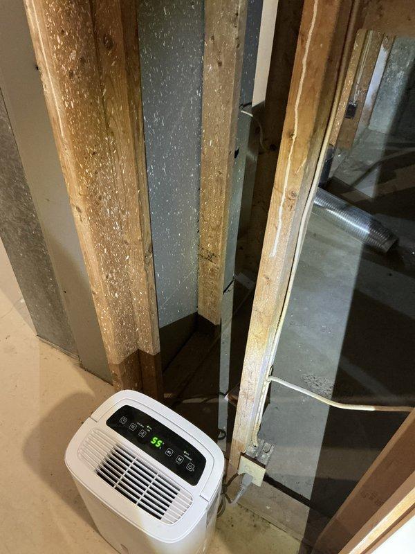 Completed estimate for adding air conditioning system to existing property. Assessed unfinished basement area with exposed framing, existing furnace/air handler unit with open access panel, and current ductwork infrastructure to determine feasibility and requirements for AC installation.
