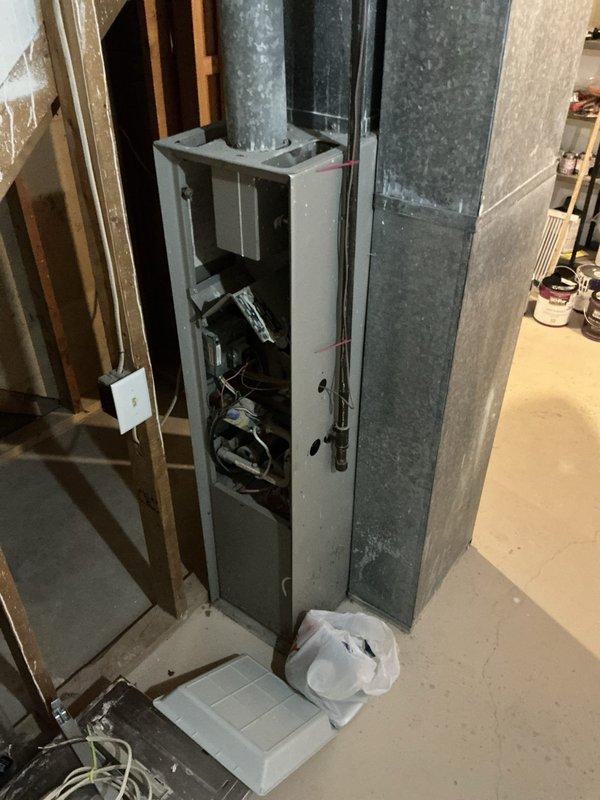 Completed estimate for adding air conditioning system to existing property. Assessed unfinished basement area with exposed framing, existing furnace/air handler unit with open access panel, and current ductwork infrastructure to determine feasibility and requirements for AC installation.