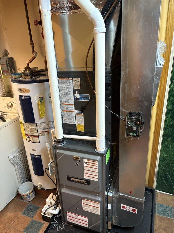 Completed full air conditioning system replacement at residential property. Installed new outdoor condensing unit on existing concrete pad with proper electrical disconnect and conduit routing, along with new indoor air handler/furnace unit in utility room. System commissioned and tested for proper operation, with all refrigerant lines connected, electrical connections verified, and condensate drainage confirmed functional.