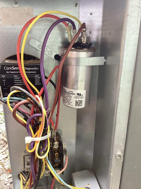 Responded to air conditioning service call for system blowing but not cooling properly on a 7-year-old unit. Upon inspection, diagnosed failed capacitor affecting compressor operation. Replaced defective capacitor with new unit, verified proper electrical connections and wire routing, and tested system for proper operation. Confirmed cooling function restored and unit operating within normal parameters.