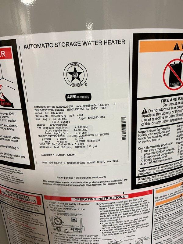 Successfully installed a 40-gallon Bradford White natural gas short water heater in basement utility area. Completed all plumbing connections using copper supply lines with brass fittings and shut-off valves, installed proper venting with galvanized ductwork, and secured unit on appropriate base. All manufacturer specifications verified, safety labels intact, and system tested for proper operation.