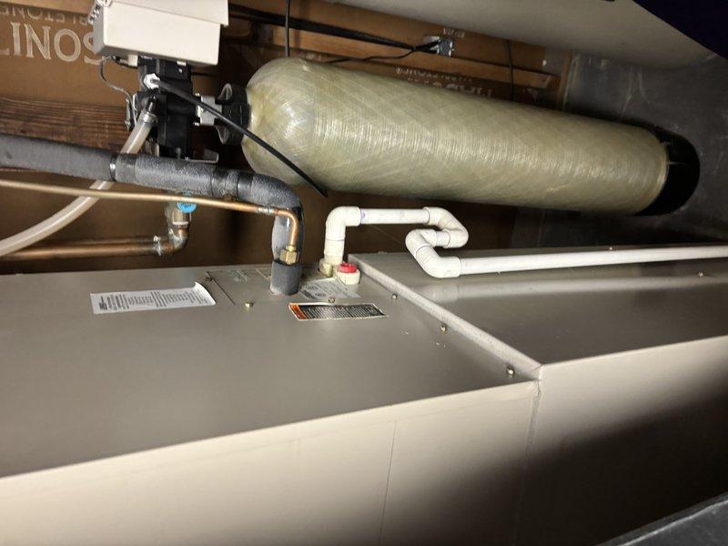 Completed comprehensive AC Super Tune-up on 19-year-old system installed in attic space. Performed full system inspection including air handler, condensate drainage lines, refrigerant lines, electrical connections, capacitor, and ductwork. All components photographed, tested, and verified operational; system running efficiently with no issues identified.