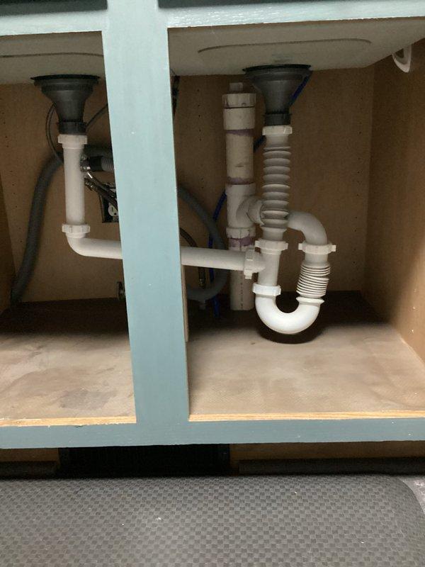 Responded to a two-item plumbing repair call. Repaired the master bathroom bathtub faucet that was failing to shut off completely, restoring proper water control to the single-handle chrome fixture. Additionally, replaced the kitchen sink drain assembly with new PVC P-trap components to ensure proper drainage and prevent leaks.