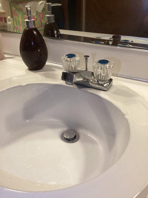 Responded to bathroom sink shut-off valve replacement request in 40-year-old home where issue had been present for 3-4 days. Successfully replaced defective shut-off valves serving the bathroom sink, restoring proper water control to the fixture. Verified P-trap assembly and drain connections were secure and functioning properly, with no leaks detected upon completion and testing of the system.