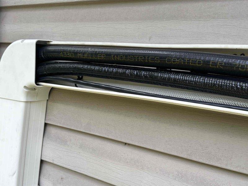 Responded to warranty call for mini-split system installed recently that was leaking water heavily. Inspected exterior wall-mounted air handler unit and refrigerant line set installation. Identified and resolved drainage issue causing water leak from indoor unit. System tested and confirmed operating properly with no further water discharge.