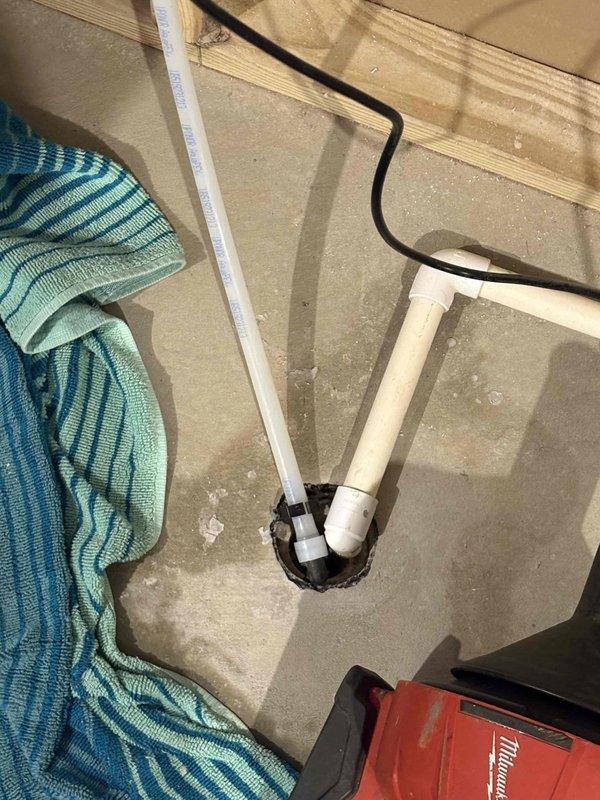 Responded to a clogged floor drain in basement utility area. Upon inspection, removed drain cover and cleared blockage from the drain line using appropriate drain cleaning equipment. Disassembled section of white PVC drain piping to access and remove accumulated debris causing the obstruction. Successfully restored proper drainage flow, reassembled all plumbing components, and tested system to verify complete functionality.