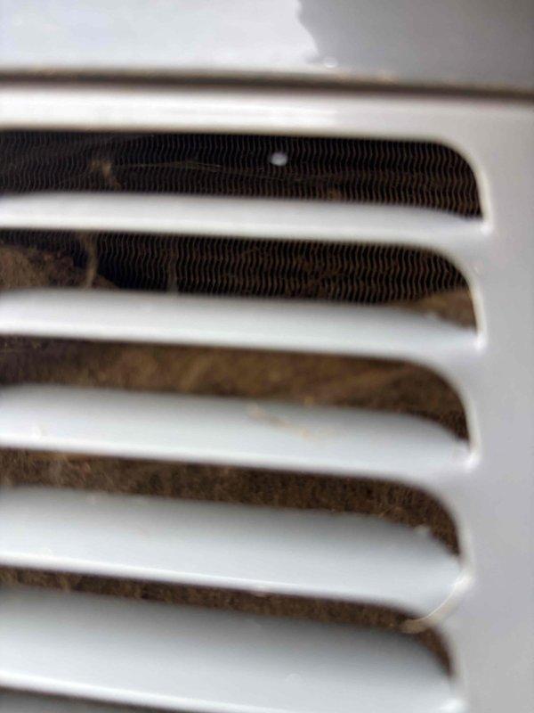Responded to service call for furnace failing to operate during air conditioning cycle. Upon inspection, found significant dust and debris accumulation on evaporator coil and air handler components, restricting airflow and causing system interlock issues. Accessed control board and verified electrical connections and relay operation. Cleaned evaporator coil fins and ventilation grille, removing built-up contaminants that were impeding proper air circulation. Tested system operation and confirmed furnace blower now functions correctly in coordination with cooling cycle. System restored to normal operation with improved airflow efficiency.