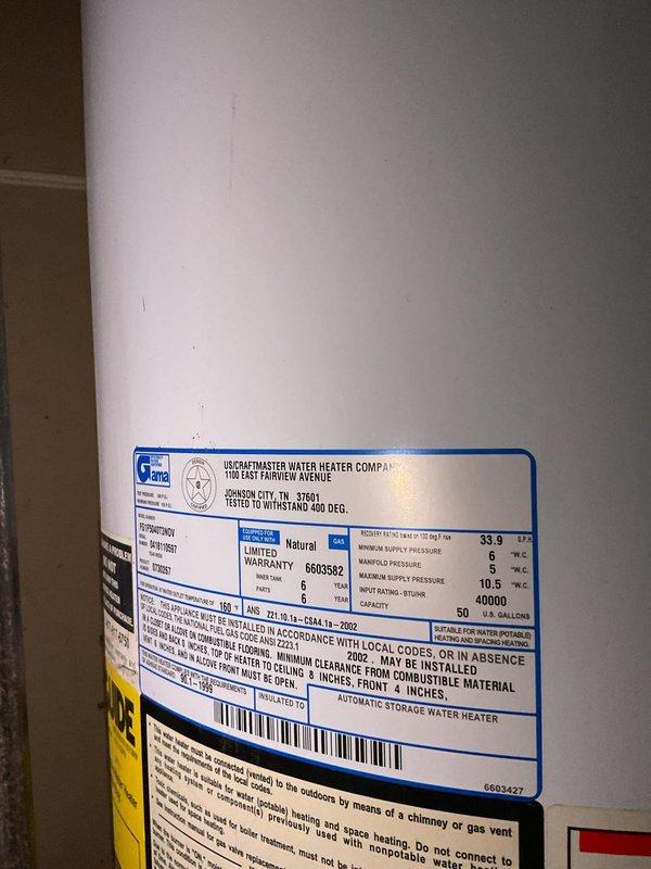 Responded to no hot water complaint on residential gas water heater. Upon arrival, inspected 33-gallon natural gas water heater manufactured by Liberat Master Water Heater Company. Unit serial number 6305582 indicated installation date from 2002, making the water heater approximately 23 years old and well beyond its expected service life. Verified no hot water production and confirmed pilot light would not remain lit after customer's previous relight attempts. Conducted visual inspection of unit and surrounding plumbing connections, confirming no active leaks or water damage present. Examined gas supply, thermocouple, pilot assembly, and burner components. Due to the age of the unit and failure of pilot to remain lit, advised that water heater has reached end of useful life and requires replacement. Documented existing installation configuration including copper supply lines, PVC venting system, and blue shutoff valve at top of tank. Photographed unit specifications and overall install
