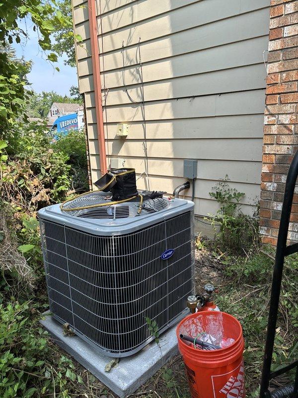 Completed full HVAC system replacement including outdoor condensing unit and indoor air handler. Installed new condenser on existing concrete pad with proper electrical disconnect and refrigerant line connections. Mounted air handler in basement mechanical space with new ductwork connections, condensate drain lines, and electrical wiring. System was tested, charged, and verified operational upon completion.