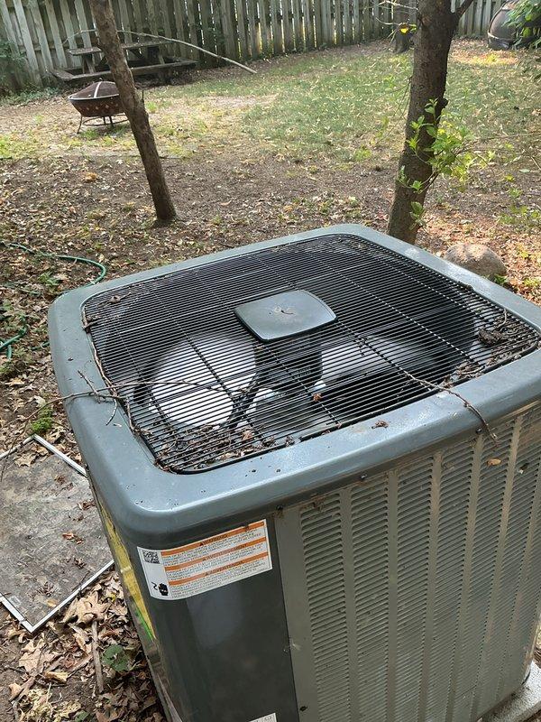 Completed annual cooling maintenance on 2019 outdoor condensing unit. Performed comprehensive system inspection, cleaned condenser coils and louvers removing accumulated debris, dirt, and cobwebs from exterior panels and ventilation grilles. Verified unit operation and documented equipment condition with photos showing weathered exterior consistent with outdoor exposure.