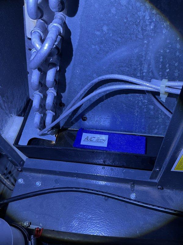 Completed annual cooling maintenance on 2015 EnergiAir system under 5-year warranty agreement. Performed comprehensive AC tune-up including inspection of air handler cabinet interior, verified proper operation of A/C Ease condensate treatment system, checked PVC drainage lines and refrigerant line connections with proper securing of flexible hoses and zip ties. Inspected exterior ventilation louvers and grills, noting normal wear consistent with age and outdoor exposure. All components operating within manufacturer specifications, system ready for cooling season.