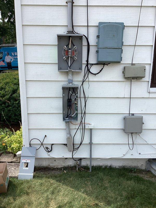 Completed add-on air conditioning installation with 100-amp electrical service upgrade. Coordinated utility disconnect/reconnect and obtained electrical permit PE26-0849, with all work passing inspection. Installed new outdoor condensing unit on concrete pad, ran refrigerant lines, upgraded electrical service panel with new breaker boxes and conduit, and restored power upon completion of inspection.