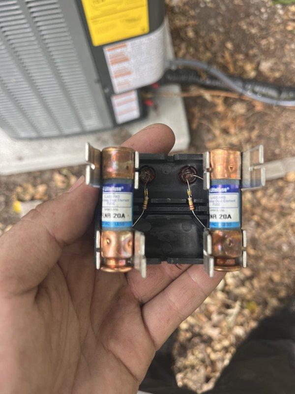 Responded to failed inspection due to code violation regarding incorrect amperage breaker installation. Replaced 30-amp breaker with proper 20-amp fuses to match maximum amp capacity specifications for HVAC disconnect. Verified correct NR 20A time-delay fuses were installed in exterior disconnect box and confirmed system operation following correction.