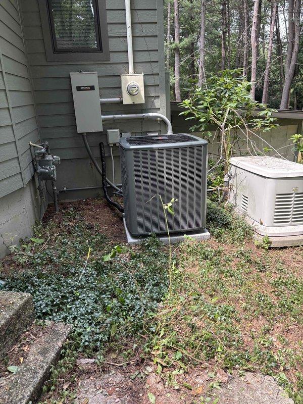 Completed full HVAC system installation including new furnace and air conditioning unit at residential property. Installed gray furnace with proper drain pan in mechanical room, connected to metallic air handler with integrated ductwork system. Mounted exterior AC condenser unit on concrete pad with appropriate electrical disconnect, conduit runs, and PVC drainage piping. All equipment properly positioned, vented, and connected per manufacturer specifications and local code requirements.