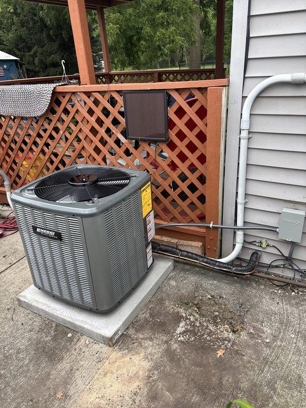 Completed full residential air conditioning system replacement. Removed existing unit and installed new outdoor condenser on concrete pad against exterior wall with proper electrical disconnect and line set connections. Charged system with refrigerant per manufacturer specifications (53 oz factory charge, 8 oz field charge, 61 oz total charge). Verified all electrical connections, service valves, and safety controls operational. System tested and confirmed cooling properly upon startup.
