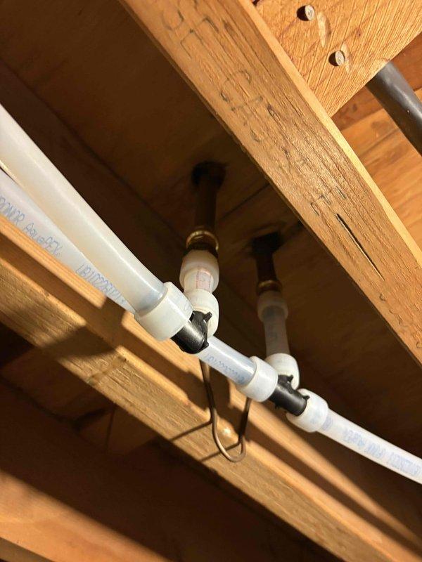 Completed whole home water repipe installation over two-day period, replacing existing plumbing supply lines throughout the residence. Installed new PVC supply piping in attic space, properly secured to structural framing with mounting clips, and upgraded mechanical room plumbing infrastructure including connections to water heater and pressure tank systems. All new piping was professionally routed, secured to code specifications, and tested for proper operation upon completion.