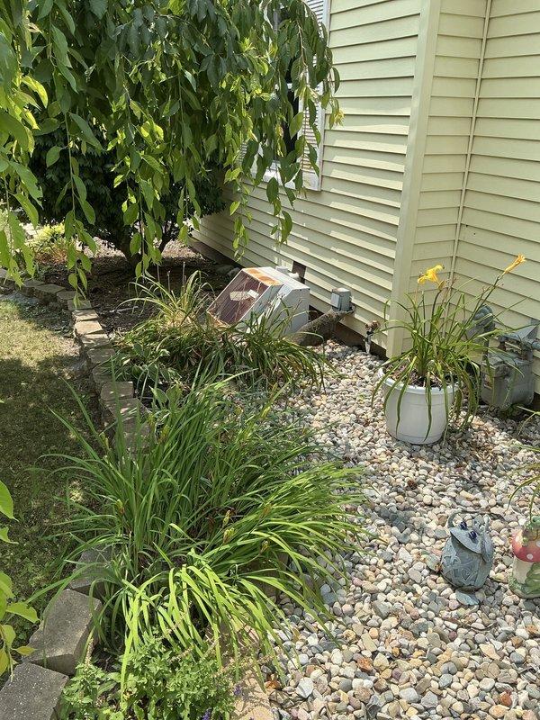 Conducted comprehensive estimate for furnace and air conditioning system replacement at residential property. Evaluated existing basement HVAC installation, including current furnace unit with connected ductwork and associated utility infrastructure. Assessed exterior equipment location and access points in side yard area with existing landscaping and foundation clearances. Documented current system configuration, ductwork routing, electrical connections, and venting arrangements to provide accurate replacement specifications and installation requirements.