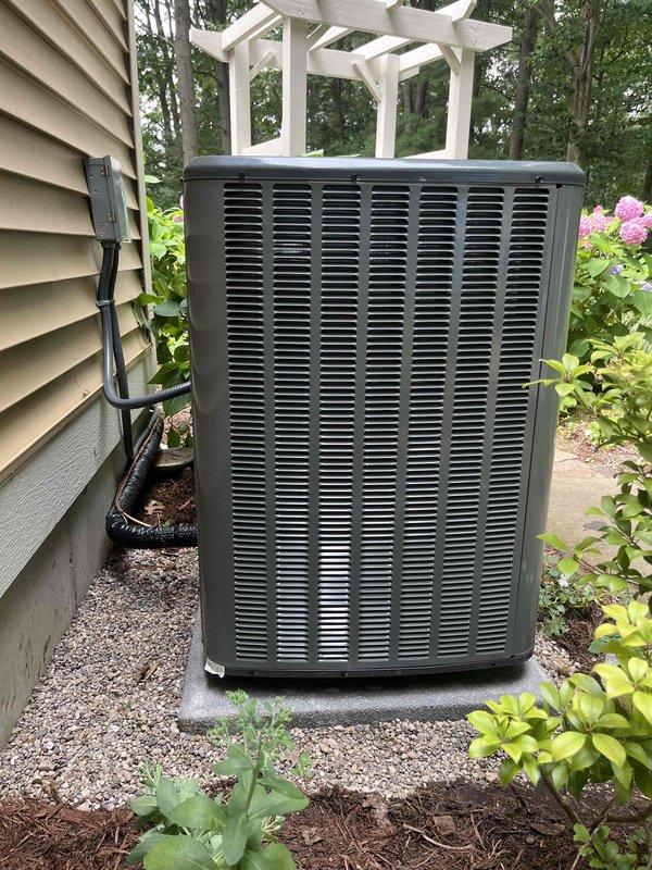 Completed full system replacement of residential HVAC equipment and water heater. Removed existing furnace, air handler, outdoor condenser unit, and water heater. Installed new gray metal furnace unit with black air handler/evaporator coil assembly in basement mechanical room. Mounted equipment vertically with proper spacing and clearances per manufacturer specifications. Connected white PVC drainage and venting pipes with appropriate routing. Installed black flexible ductwork from air handler to existing duct system. Connected metal supply ductwork and verified proper airflow pathways. Mounted electrical panel and completed all power connections with proper disconnects. Positioned new outdoor condenser unit on existing concrete pad with gravel surround adjacent to house exterior. Installed electrical conduit from wall-mounted disconnect box to condenser unit. Verified proper clearances around outdoor unit for airflow and future maintenance access. Completed all refrigerant line connec