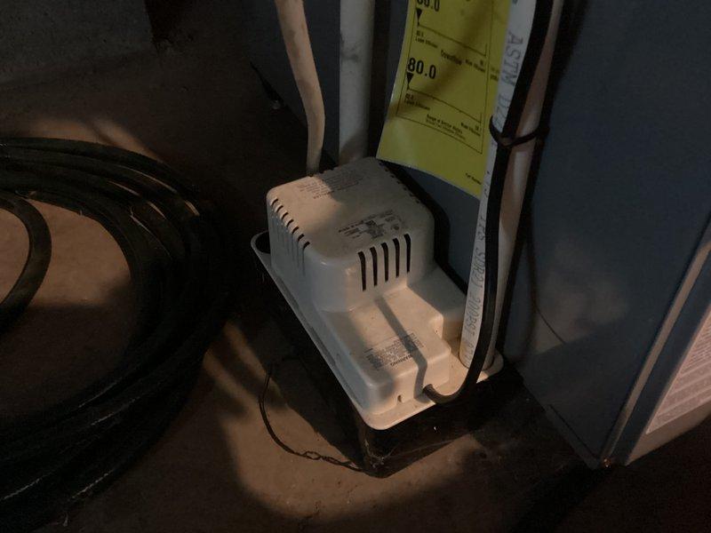 Completed annual cooling maintenance and tune-up on HVAC system. Inspected condensate pump operation, drainage lines, and associated components; all equipment found operating within normal parameters. Documentation photos taken of installation and system components for service records.