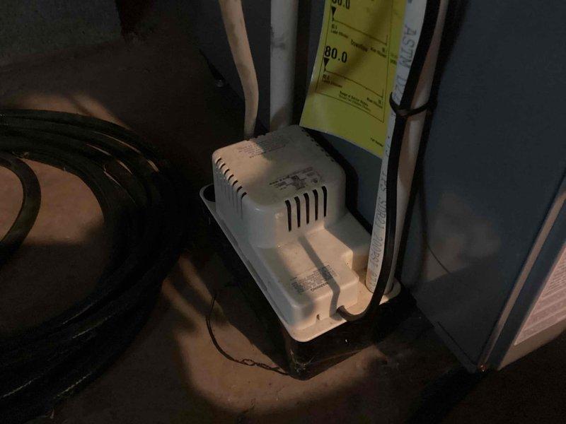 Completed annual cooling maintenance and tune-up on HVAC system. Inspected condensate pump operation, drainage lines, and associated components; all equipment found operating within normal parameters. Documentation photos taken of installation and system components for service records.