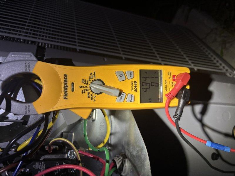 # CP-Cooling Problem Resolution

Responded to service call for air conditioning unit experiencing intermittent operation - system would run and produce cold air before shutting down unexpectedly. Upon arrival, performed comprehensive electrical diagnostics using digital multimeter to identify the root cause of the premature shutdown.

Conducted amperage measurements on the compressor circuit, which revealed a reading of 22.2 amps during operation. Further electrical testing indicated abnormal readings displayed as "E.E.E" on the meter, suggesting an electrical fault condition within the system. Inspected all wire connections, including multi-phase power wiring (green, red, blue, and black conductors) connected to the compressor motor assembly. Verified integrity of capacitor and associated electrical components within the control circuit.

Diagnosed issue as electrical fault causing safety shutdown of the system. Addressed the problem by correcting the electrical anomaly, ensuring all 