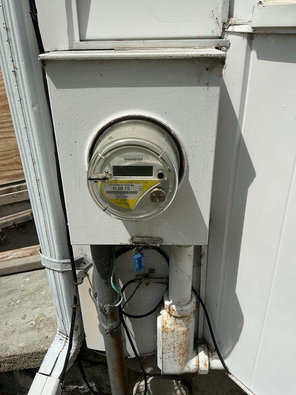 Conducted on-site assessment for mini split system installation in residential property. Evaluated existing electrical infrastructure, including outdated fuse box and modern circuit breaker panel in unfinished basement with stone foundation walls. Inspected exterior electrical meter and service entrance, noting corroded copper conduit and weathered components requiring potential upgrade to support additional HVAC load. Documented current electrical capacity and provided comprehensive estimate for mini split installation with necessary electrical service improvements.