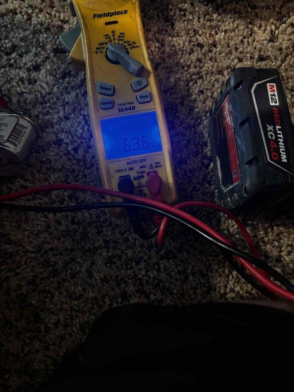 Completed annual cooling system tune-up on 21-year-old Bryant unit. Performed standard diagnostics using digital multimeter to verify electrical readings and system performance, inspected condensate drain line through ceiling access point, and confirmed proper operation of all components. Unit operating within normal parameters for recurring maintenance service.
