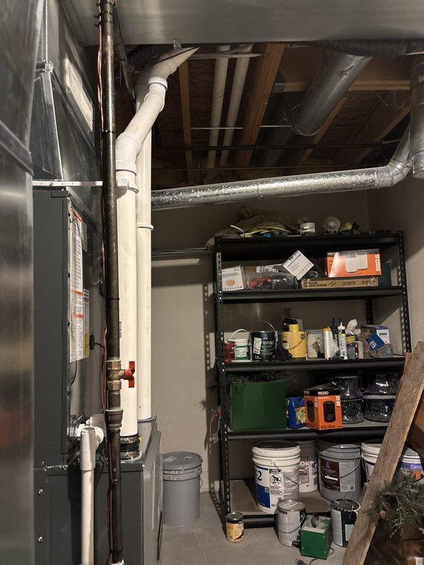 Completed full HVAC system installation including new furnace and air conditioning unit. Installed outdoor condenser unit on concrete pad with proper refrigerant line sets and electrical connections routed along exterior siding. Indoor furnace/air handler installed in basement utility area with new ductwork connections, PVC condensate drainage system, and proper venting. All equipment commissioned, tested for proper operation, and system left running efficiently.