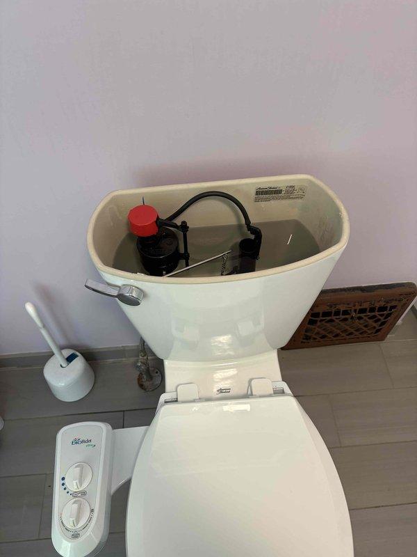 Responded to toilet continuously running due to failed flush valve seal. Removed tank lid, inspected internal components, and replaced faulty flush valve assembly to restore proper sealing and stop water waste. Verified proper operation and water shutoff after flush cycle completion.