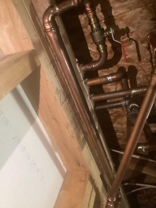 Provided detailed estimate for installation of dedicated city water line from basement to kitchen. Assessed existing copper piping infrastructure in basement utility area, including multiple parallel runs, brass fittings, shutoff valves, and mounting configurations. Evaluated kitchen sink location, countertop access points, and optimal routing path for new water supply line to deliver municipal water directly to kitchen fixtures.