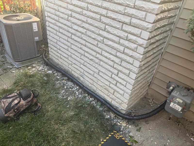 Completed annual cooling maintenance on 9-year-old Lennox system. Performed standard tune-up procedures including inspection of outdoor condenser unit, refrigerant lines, and electrical connections. Per client request, inspected insulation around penetration point where AC coils pass through interior wall—found insulation intact and properly sealed. Verified refrigerant line set routing along foundation, checked condenser operation, and confirmed all components functioning within normal parameters. System operating efficiently with no deficiencies noted.
