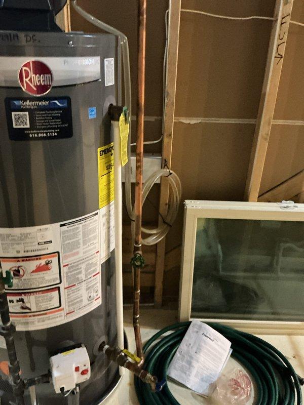 Responded to service call for noisy water heater still in operation. Inspected 7+ year old Rheem unit and identified noise consistent with sediment buildup in tank. Evaluated overall condition of water heater, plumbing connections, and associated components including recirculation pump mounted on top of unit. Documented existing installation with copper supply lines, PVC venting configuration, and shut-off valves. Advised customer that unit is approaching end of typical service life and noise indicates internal deterioration that will likely require replacement in near future, though system remains functional at present time.
