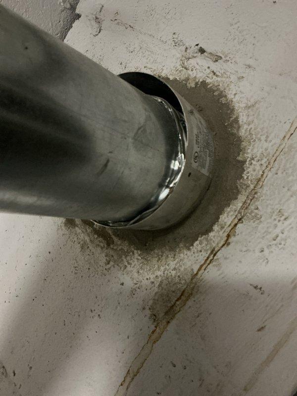 Responded to no-heat complaint on 15-year-old AO Smith water heater. Upon inspection, documented existing installation including copper supply lines, proper venting through exterior wall, and drain pan placement. Unit showed signs of age-related wear consistent with end of typical service life for residential water heaters.