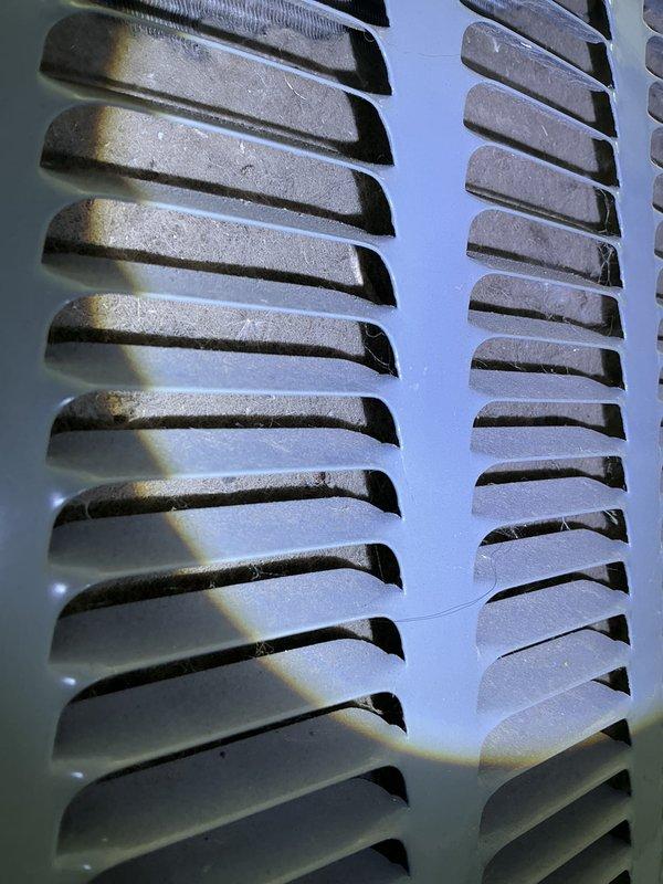# ASTU-AC Super Tune-Up Completed

Performed comprehensive 5-year super tune-up service on EnergiAir WT 08-2030 system, including thorough cleaning of heavily soiled ventilation grilles and heat exchanger fin assemblies that showed significant dust, grime, and cobweb accumulation. Restored system components to optimal operating condition, removing debris from louvered panels and fin surfaces to ensure proper airflow and heat transfer efficiency.