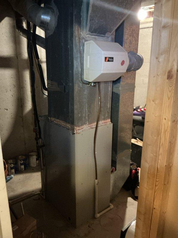 Responded to follow-up service call for ongoing no hot water issue. Upon arrival, inspected 10-year-old water heater and associated plumbing connections in basement utility area. Performed diagnostic testing and visual assessment of unit condition, heating elements, and electrical components. Documented existing equipment configuration including furnace, humidifier, and water heater installation. Identified age-related deterioration and determined water heater replacement necessary due to equipment failure and end of service life. Recommended full unit replacement to restore hot water service.
