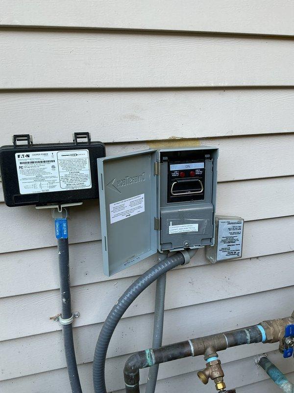 Completed disconnect replacement at residential exterior electrical service point. Removed existing failed disconnect and installed new EATON brand electrical disconnect box with proper conduit connections. Verified proper operation of metering equipment in adjacent Kirby Risk panel, confirmed digital display functionality and all electrical connections secure. All work performed to code with weather-resistant installation on vinyl siding exterior.