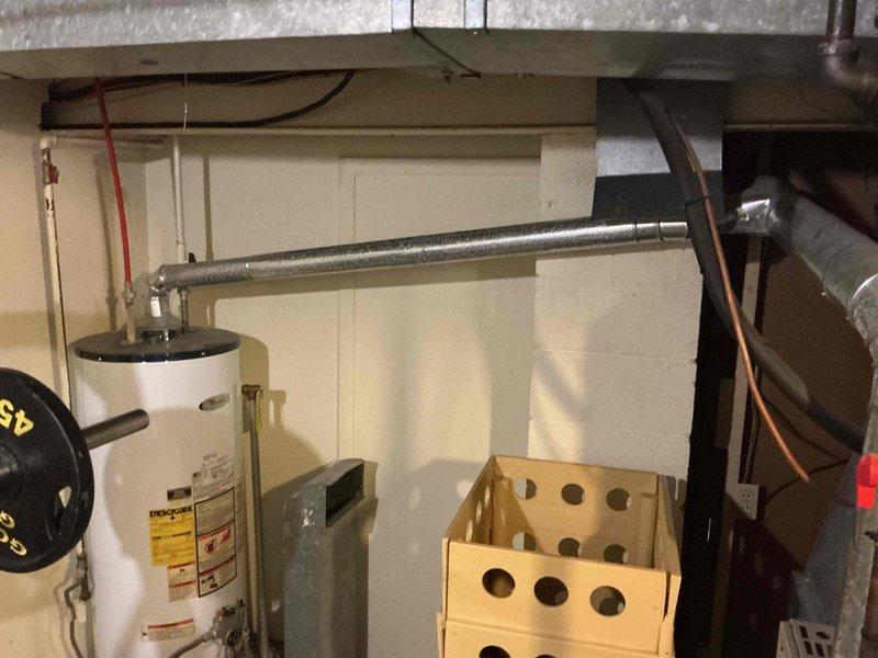 Provided estimate for replacement of existing conventional tank-type water heater with new tankless water heater system in approximately seventy-year-old residential property. Assessed current installation configuration, existing plumbing connections, venting requirements, electrical service capacity, and gas line specifications necessary for tankless conversion. Documented existing equipment condition and utility room layout with photographic records to support proposal development for complete system upgrade.