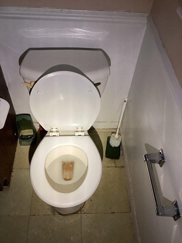 Responded to service call for two toilets experiencing difficulty flushing. Upon arrival, inspected both units and found significant mineral buildup and deposits in the bowls affecting flush performance. Cleared obstructions, adjusted flush mechanisms, and tested both toilets to ensure proper operation. Both fixtures now flushing correctly with adequate water flow and complete bowl evacuation.